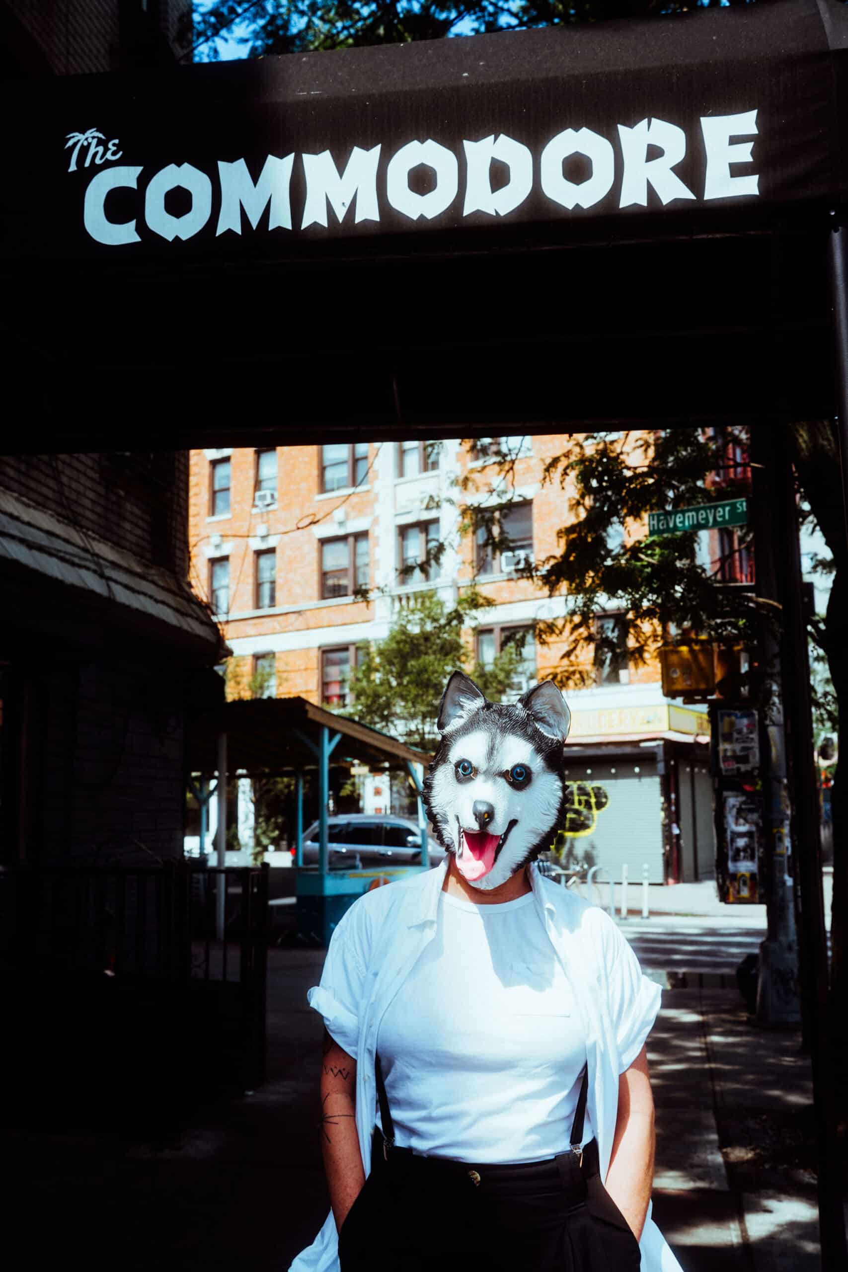 The Commodore sign on top, a person with a wolf mask on the bottom
