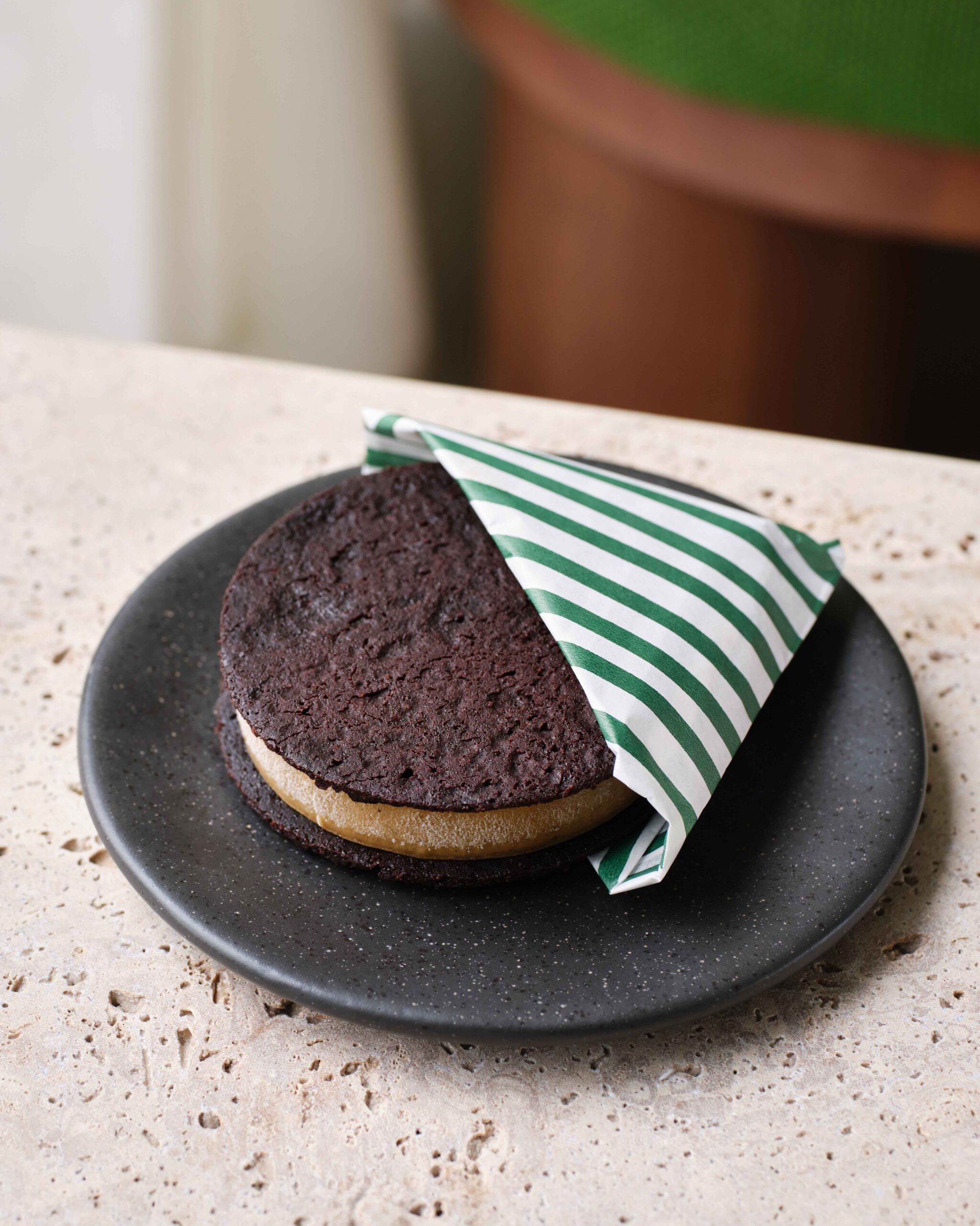 a chocolate cookie in a black dish